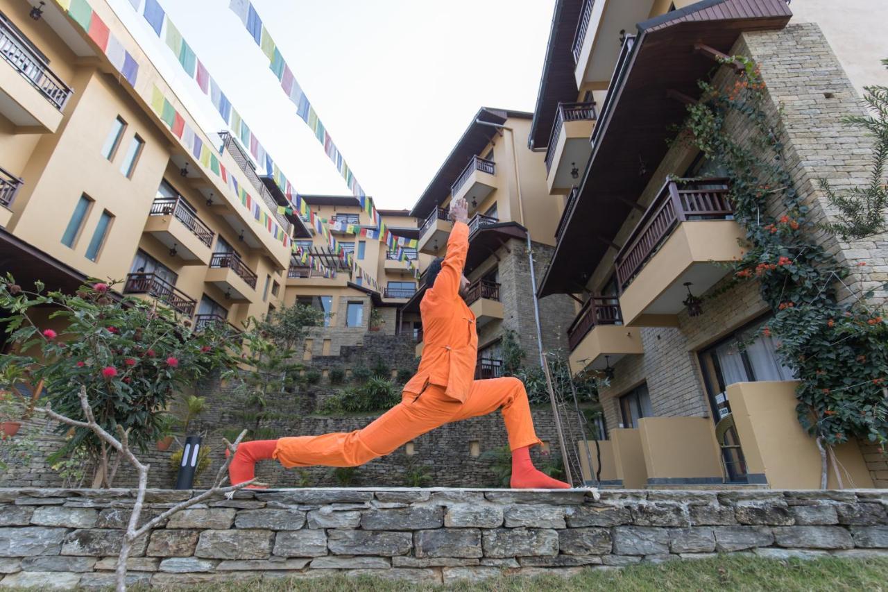 Bar Peepal Resort Покхара Екстер'єр фото A student of the Drepung Loseling Nunnery, practicing yoga.